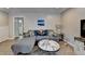 Spacious living room with hardwood floors, gray walls, and stylish modern furniture at 1119 Riverbend Club Se Dr, Atlanta, GA 30339