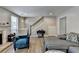 Cozy living room with a decorative fireplace, gray walls, and wood-look floors at 1119 Riverbend Club Se Dr, Atlanta, GA 30339