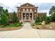 Brick building exterior with symmetrical facade, columns, and landscaped grounds at 155 Alcovy Ter, Alpharetta, GA 30009