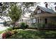 Street view of vintage-looking commercial buildings with manicured lawns, flowers and sidewalks at 155 Alcovy Ter, Alpharetta, GA 30009