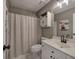 Bathroom with vanity, framed mirror, and shower with neutral patterned curtain at 2186 Mainsail Dr, Marietta, GA 30062