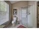 Modern bathroom featuring a glass-enclosed shower and tiled floors at 2186 Mainsail Dr, Marietta, GA 30062