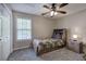 Bedroom with a bed featuring built-in shelves, neutral walls, and carpeted floors at 2186 Mainsail Dr, Marietta, GA 30062
