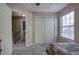 Carpeted bedroom with closet, window and doorway featuring white trim at 2186 Mainsail Dr, Marietta, GA 30062