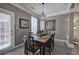 Charming dining room with a stylish chandelier and a view of the backyard through the window at 2186 Mainsail Dr, Marietta, GA 30062