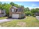 Charming two-story home with a two-car garage, manicured lawn, and professional landscaping at 2186 Mainsail Dr, Marietta, GA 30062