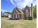 Well-maintained home with mature landscaping, a spacious lawn, and a classic design at 2186 Mainsail Dr, Marietta, GA 30062