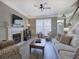 Inviting living room with a fireplace, large window, and comfortable seating, ideal for relaxation at 2186 Mainsail Dr, Marietta, GA 30062