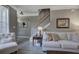 Cozy living room features comfortable seating, natural light, and view of stairs at 2186 Mainsail Dr, Marietta, GA 30062