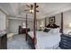 Spacious main bedroom with a four-poster bed and a decorative tray ceiling at 2186 Mainsail Dr, Marietta, GA 30062