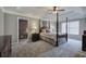 Comfortable main bedroom featuring a tray ceiling, soft carpet, and lots of space at 2186 Mainsail Dr, Marietta, GA 30062