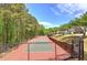 Community tennis courts surrounded by lush greenery, providing a perfect setting for outdoor recreation at 2186 Mainsail Dr, Marietta, GA 30062