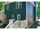 The back of the home has an entrance and stairs to the backyard space at 22 Haygood Se Ave, Atlanta, GA 30315