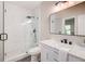 Modern bathroom featuring a glass shower, white marble vanity, and updated fixtures at 22 Haygood Se Ave, Atlanta, GA 30315