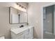 Bathroom with a white vanity, marble countertop, and modern lighting at 22 Haygood Se Ave, Atlanta, GA 30315