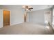 Bright and airy bedroom featuring plush carpet, ensuite bathroom, and ample closet space at 22 Haygood Se Ave, Atlanta, GA 30315