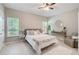 Light and airy bedroom with two windows and a ceiling fan at 22 Haygood Se Ave, Atlanta, GA 30315