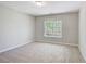 Comfortable bedroom with carpet and a large window offering ample sunlight at 22 Haygood Se Ave, Atlanta, GA 30315