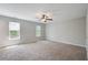 Expansive bedroom featuring plush carpeting, a ceiling fan, and abundant natural light at 22 Haygood Se Ave, Atlanta, GA 30315