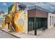 Modern building showcasing a striking mural, contemporary architecture, and outdoor seating at 22 Haygood Se Ave, Atlanta, GA 30315