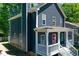 Charming two-story home featuring a cozy front porch, blue siding, and white trim at 22 Haygood Se Ave, Atlanta, GA 30315