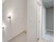 Hallway with sconce lighting leads to a bedroom at 22 Haygood Se Ave, Atlanta, GA 30315