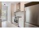 Contemporary kitchen featuring stainless steel appliances and white cabinetry at 22 Haygood Se Ave, Atlanta, GA 30315