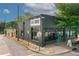 A grey building featuring the 'Wood's Chapel BBQ' logo and large windows at 22 Haygood Se Ave, Atlanta, GA 30315