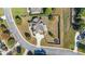 An aerial view of a home with a manicured lawn, circular driveway, and fenced backyard at 416 Battlefield Creek Dr, Marietta, GA 30064