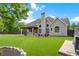 Expansive backyard featuring a pergola-covered patio and lush green lawn at 416 Battlefield Creek Dr, Marietta, GA 30064