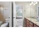 Bathroom with double sinks, granite countertop, tile floor, and bath shower combo at 416 Battlefield Creek Dr, Marietta, GA 30064