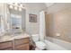 Bathroom with single sink, granite countertop, and shower with tub combo at 416 Battlefield Creek Dr, Marietta, GA 30064