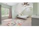 Charming bedroom with twin beds, sloped ceilings, and large windows for natural light at 416 Battlefield Creek Dr, Marietta, GA 30064