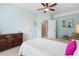 Cozy bedroom featuring a white quilt, dresser with gold pulls, and a ceiling fan at 416 Battlefield Creek Dr, Marietta, GA 30064