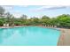 Large community pool with plenty of deck space, lounge chairs, and shade umbrellas for relaxation and enjoyment at 416 Battlefield Creek Dr, Marietta, GA 30064