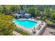 Aerial view of community pool, featuring ample lounging space, shaded seating, and a splash area at 416 Battlefield Creek Dr, Marietta, GA 30064