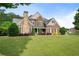 Beautiful two-story home with a large front lawn, manicured landscaping and brick exterior at 416 Battlefield Creek Dr, Marietta, GA 30064