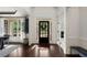 Bright foyer with hardwood floors, white trim, and view into dining and living areas at 416 Battlefield Creek Dr, Marietta, GA 30064