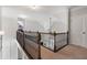 Upstairs hallway boasts wood and iron railings, with light walls and carpet flooring at 416 Battlefield Creek Dr, Marietta, GA 30064