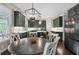 Stylish kitchen with dark green cabinets, stainless steel appliances, and an island with bar seating at 416 Battlefield Creek Dr, Marietta, GA 30064