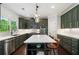 Gorgeous kitchen with stainless appliances, stone countertops, and an island with space for seating at 416 Battlefield Creek Dr, Marietta, GA 30064