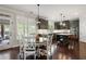 Eat-in kitchen with modern appliances, dark green cabinetry, and access to an outdoor space at 416 Battlefield Creek Dr, Marietta, GA 30064