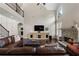 Comfortable living room with a stone fireplace, hardwood floors, and a view to the staircase at 416 Battlefield Creek Dr, Marietta, GA 30064