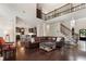 Open-concept living space with hardwood floors, modern staircase, and a glimpse of the updated kitchen at 416 Battlefield Creek Dr, Marietta, GA 30064
