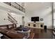 Cozy living room with dark hardwood floors, a sectional sofa, and a view of the upper level at 416 Battlefield Creek Dr, Marietta, GA 30064