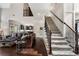 Bright, open living space with hardwood floors, elegant staircase, and a glimpse into the modern kitchen at 416 Battlefield Creek Dr, Marietta, GA 30064