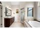 Elegant main bathroom featuring a glass shower enclosure and large garden tub at 416 Battlefield Creek Dr, Marietta, GA 30064