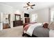 Spacious main bedroom with dark wood furniture and adjoining bathroom at 416 Battlefield Creek Dr, Marietta, GA 30064