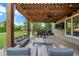 Inviting outdoor patio with a pergola, grill, and outdoor television at 416 Battlefield Creek Dr, Marietta, GA 30064