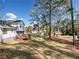 Expansive backyard with a wooden deck, mature trees, and a lush lawn at 4347 Pleasant Ridge Rd, Decatur, GA 30034